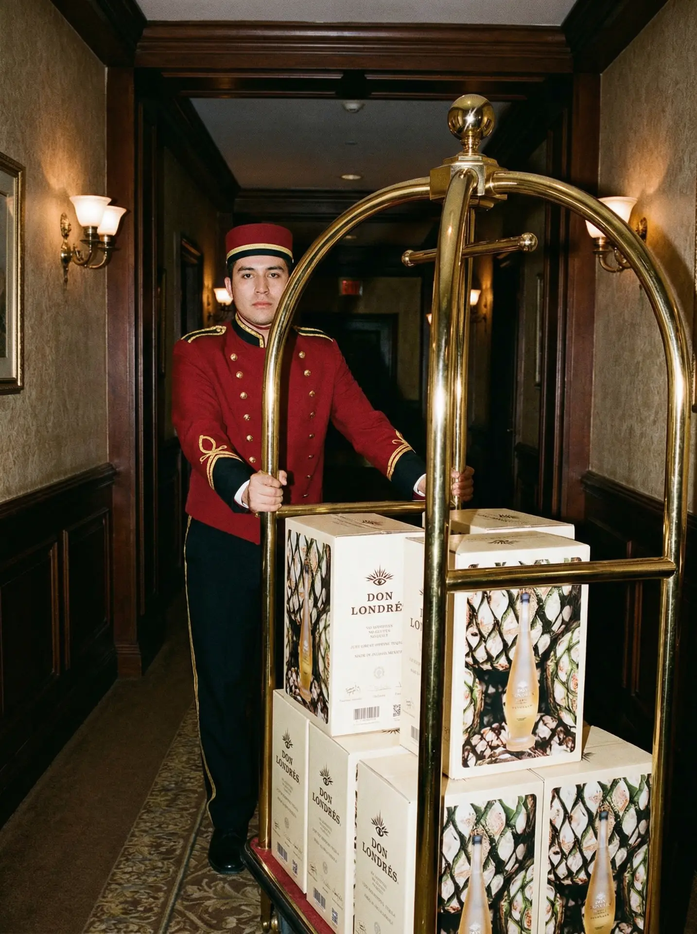 Don Londrés bellhop with product boxes